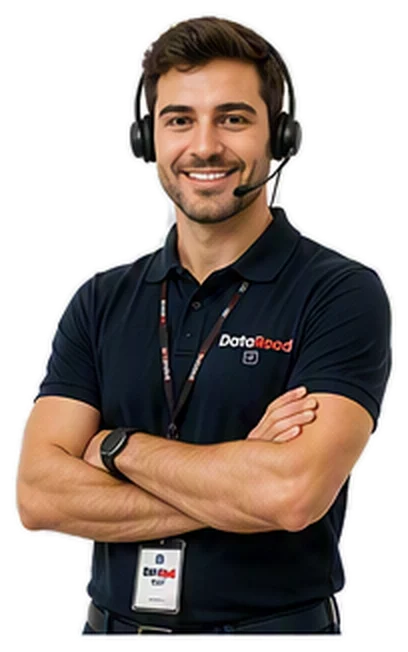 A support agent wearing a headset and microphone, arms crossed, smiling in a navy DataRoad polo shirt with a badge.